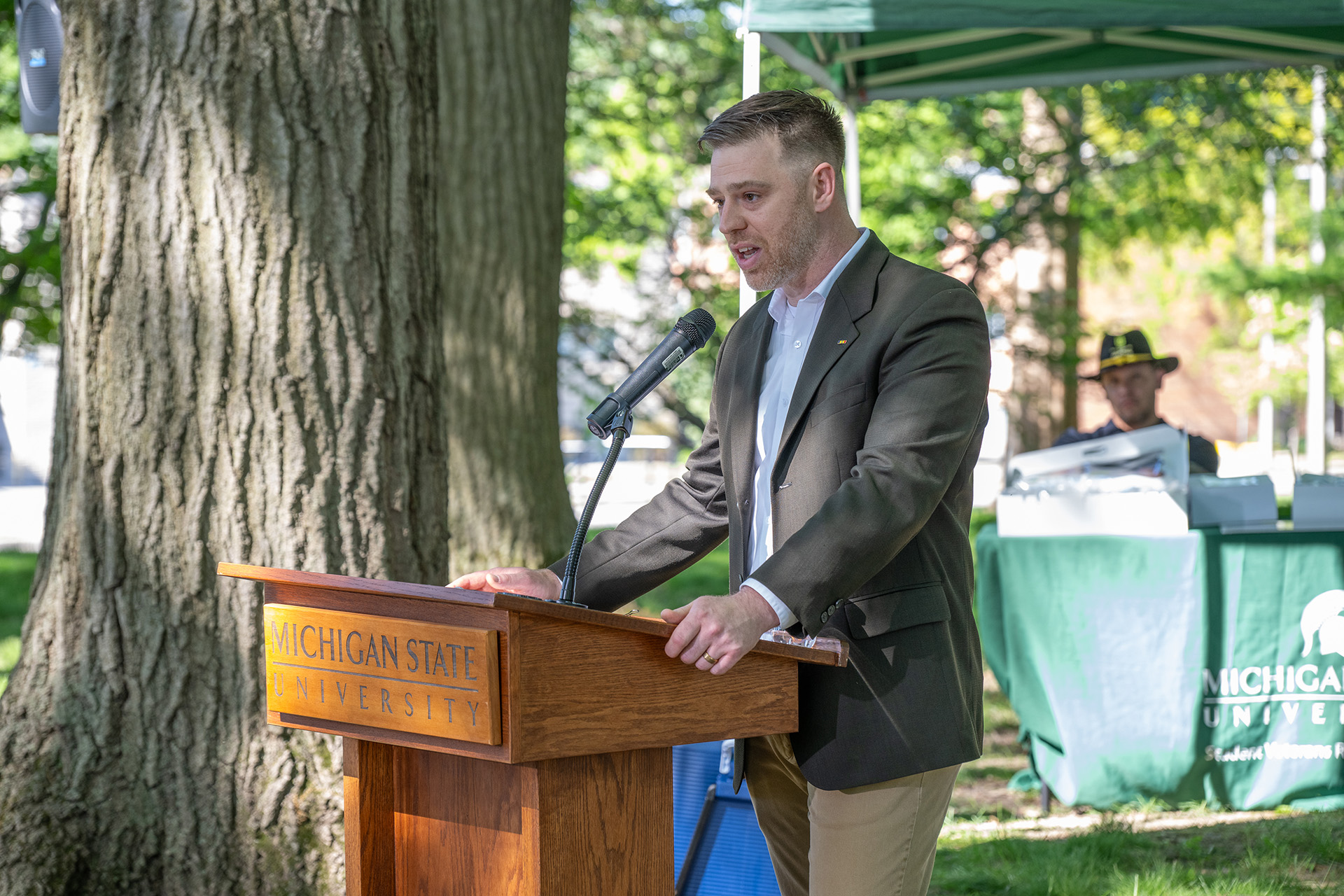 Patrick Forystek speaks at the lectern