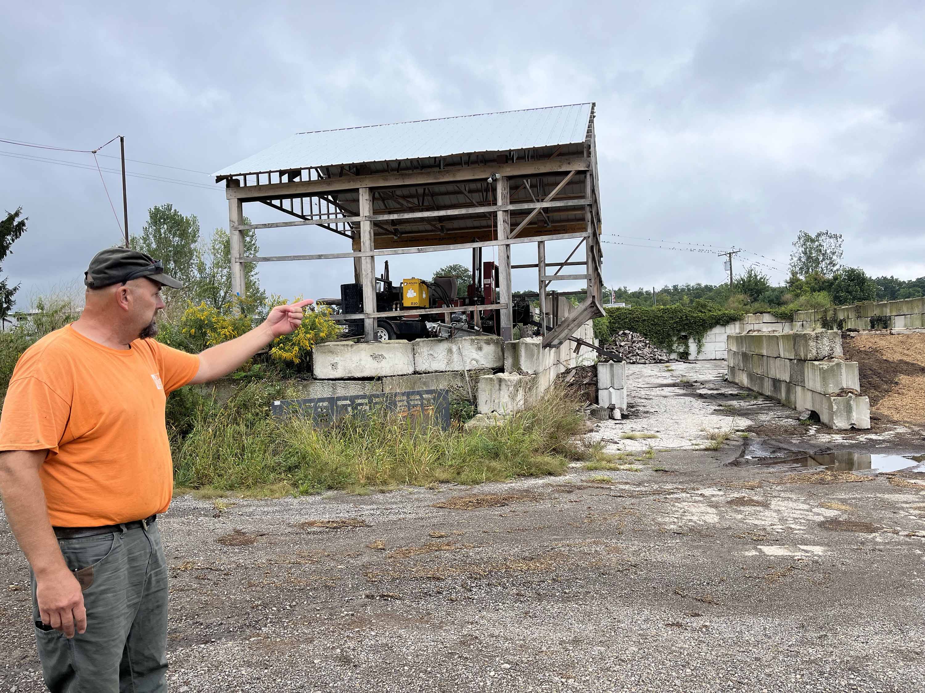 Jason Grostic pointing at storage bins