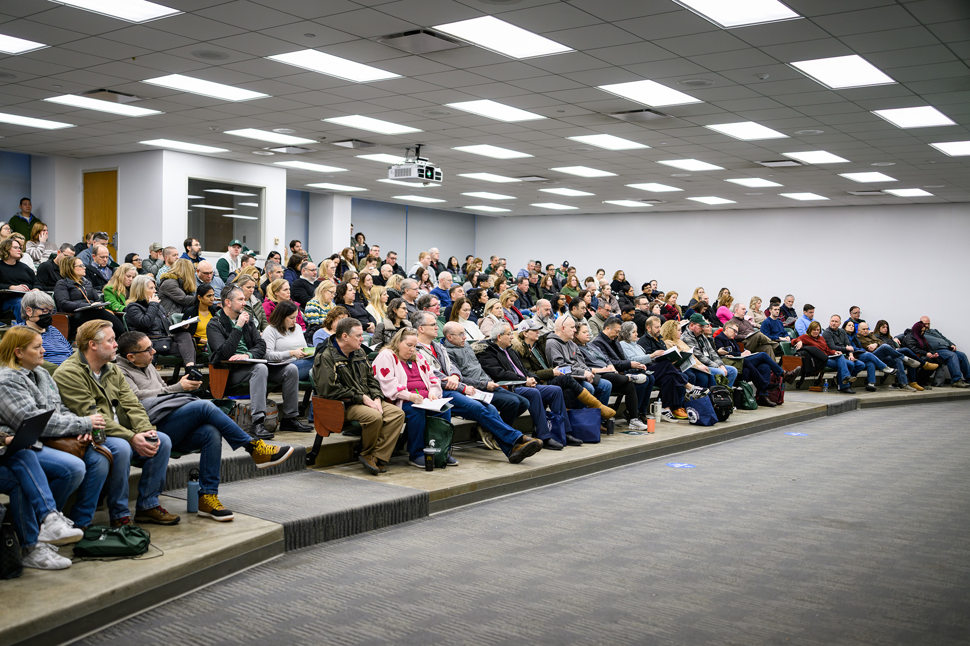 parents sitting in a large lecture room